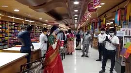 Saree-clad robot mannequin provides customers with hand sanitiser inside shop in southern India