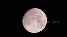 Moon with Jupiter and five of Jupiter's moons, as seen by stargazer in Kent, UK