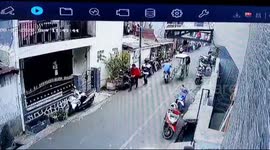 Motorists hit a cart selling corn, east Jakarta, Indonesia