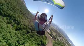 Slovakian speedflyer glides dangerously close to treetops on French mountain