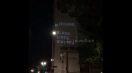 Black Lives Matter slogans projected onto The Mark O. Hatfield United States Courthouse in Portland