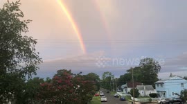 Beautiful double rainbow develops during New Jersey daybreak