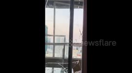 Broken glass from massive Beirut blast in Lebanon highrise apartment