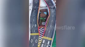 Bridge built around house after owner refuses to move in China