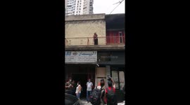 A Woman tried to express her angry against the political parties in Lebanon during Macron convoy pass in Beirut