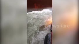 Fire tender makes way through waterlogged street as incessant rainfall, gusty wind lash western India