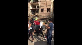 Hords of people armed with brooms and shovles cealing the streets