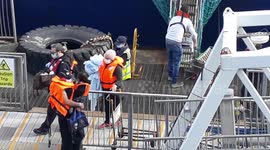 Youngest migrant who crossed the Channel seen with port officials