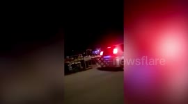 Hungry mother and baby elephant loot roadside fruit stall in Malaysia