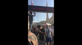 Protestors put up hanging ropes and put the pictures of the politicians on them