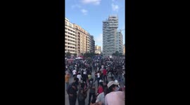 Protestors running after being tear gased