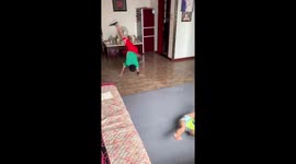 Two 4-6 year old boys practice hiphop at home