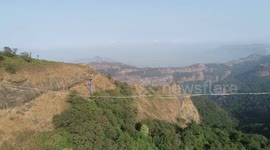 Astonishing moment man attempts to walk on 262-feet-highline in western India