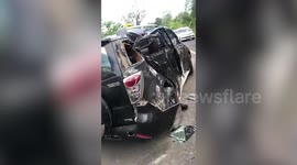 Motorcyclists jump for their lives as truck rolls backwards while smashing into cars