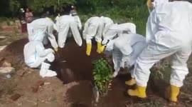 Medics bury Covid-19 'victim' by hand after terrified locals refused to lend them shovels
