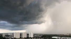 Dark grey rain storm clouds appear over Hanoi, Vietnam