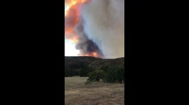 Family flees blaze near their home as California wildfire rages