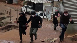 Journalists flee as rocks rain down during land protest
