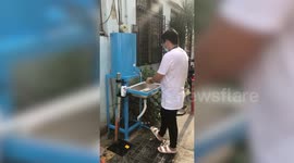 Residents in the Philippines install mandatory COVID-19 wash basins on their street