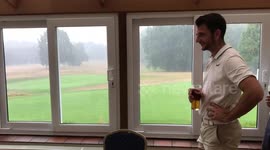 The Heavens Break as Golfers Look on from the 19th Hole