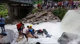 Watch - heavy water wave swept biker in Pithoragarh, SDRF team later rescued