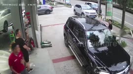 Canopy smashes front windscreen of car after wind blows it over in China