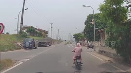 Motorcycle riders almost collide at junction