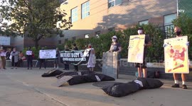 Makeshift bodybags laid outside Elmhurst Hospital in Protest