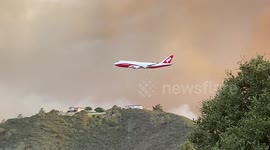 Boeing 747 Supertanker drops fire retardant on River fire in California