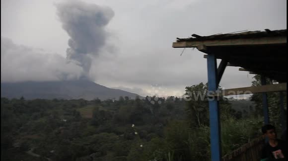 Nonchalant villagers in Indonesia watch Mount Sinabung's continued eruptions