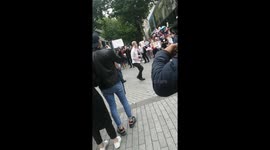 Funny moment man challenges anti-mask protesters to dance off