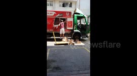 Delivery guy throws ice cream boxes on ground