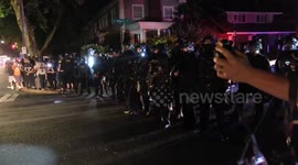 Police fire smoke bombs at protesters in Portland