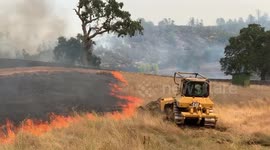 Rancher creating fire break to stop grass fire Napa co ca