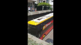 Tourist double-decker bus with a group of students smashes into underpass