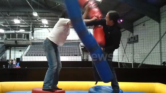 Fighting with pugil sticks