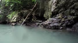Thailand kayaking with water monitor lizard
