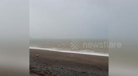 Locals run into the sea to swim as Storm Ellen batters Ireland