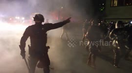 US Unrest: Portland police charge BLM protesters holding homemade shields