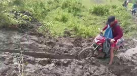 Motorcyclist Stuck On Muddy Hill After Heavy Rain