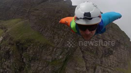 Stuntman becomes first person to successfully fly a wingsuit from a mountain in the UK