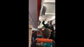 Woman Wearing Pig Mask On An Aeroplane