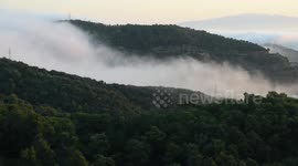Watch as cool fog cascades down from the mountains and covers Barcelona before evaporating in the city warmth