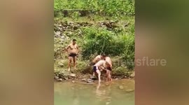 Chinese men rescue drowning teen and perform CPR to bring him back to life