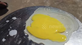 Frying eggs on hot sun heat and it works very well. Summer heat waves at its peak. Omelet without fire and oil.