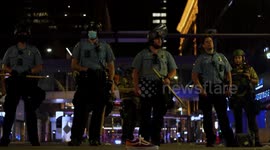 Police stand guard in Minneapolis as murder suspect's suicide sparks looting