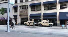 Music Plays in a Nearly Empty Downtown Minneapolis as National Guard Members Patrol The Area