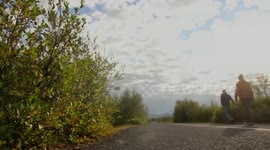 Man walking by road side
