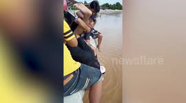 Drowning dog rescued from flooded river in northern Thailand