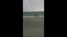 Florida beachgoers left shocked as lightning bolt strikes ocean creating booming rumble